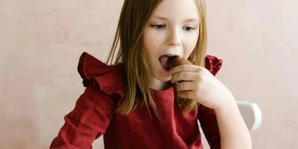 kid eating chocolate